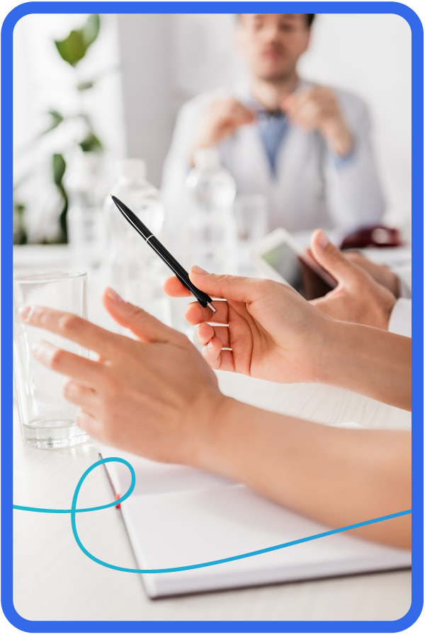 Businesswoman Standing And Leading Office Meeting Around Table